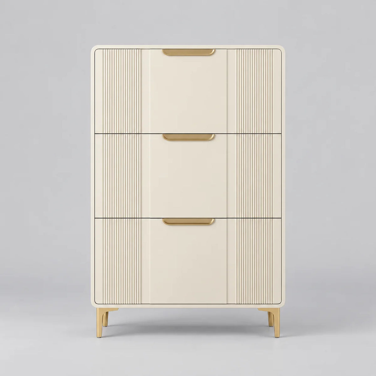 Meuble à chaussures console beige à trois compartiments, façades cannelées et poignées dorées sur fond gris Image
