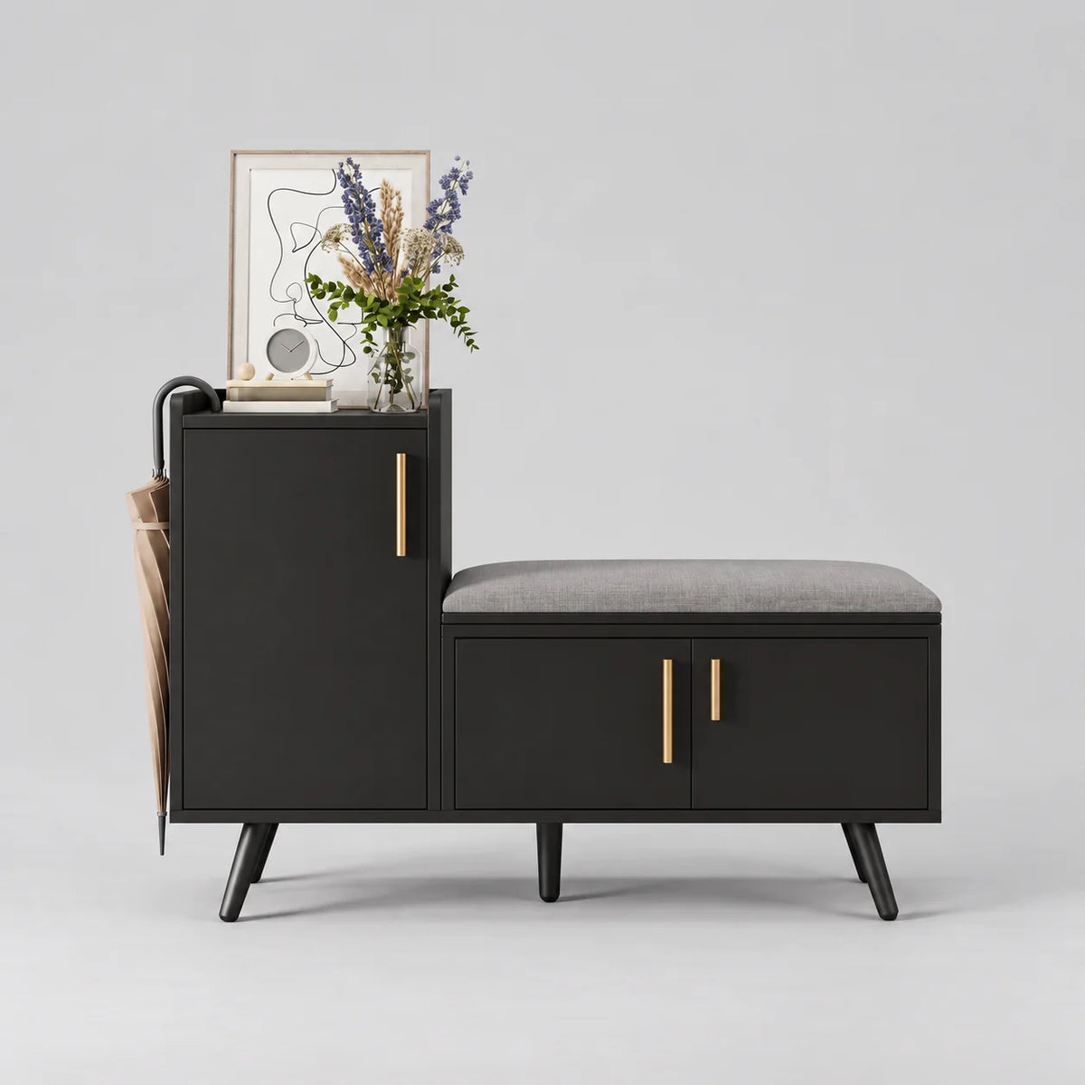 Meuble à chaussures noir avec banc gris, trois portes et poignées dorées sur fond gris Image
