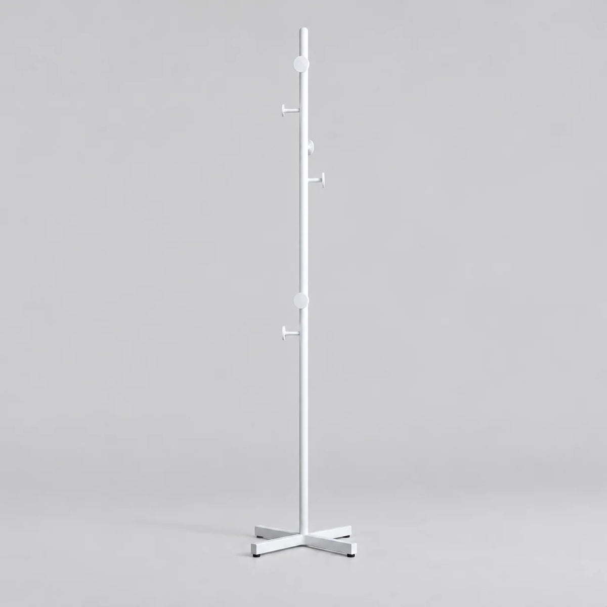 Porte-manteau champignon blanc à patères rondes et base croisée sur fond gris Image