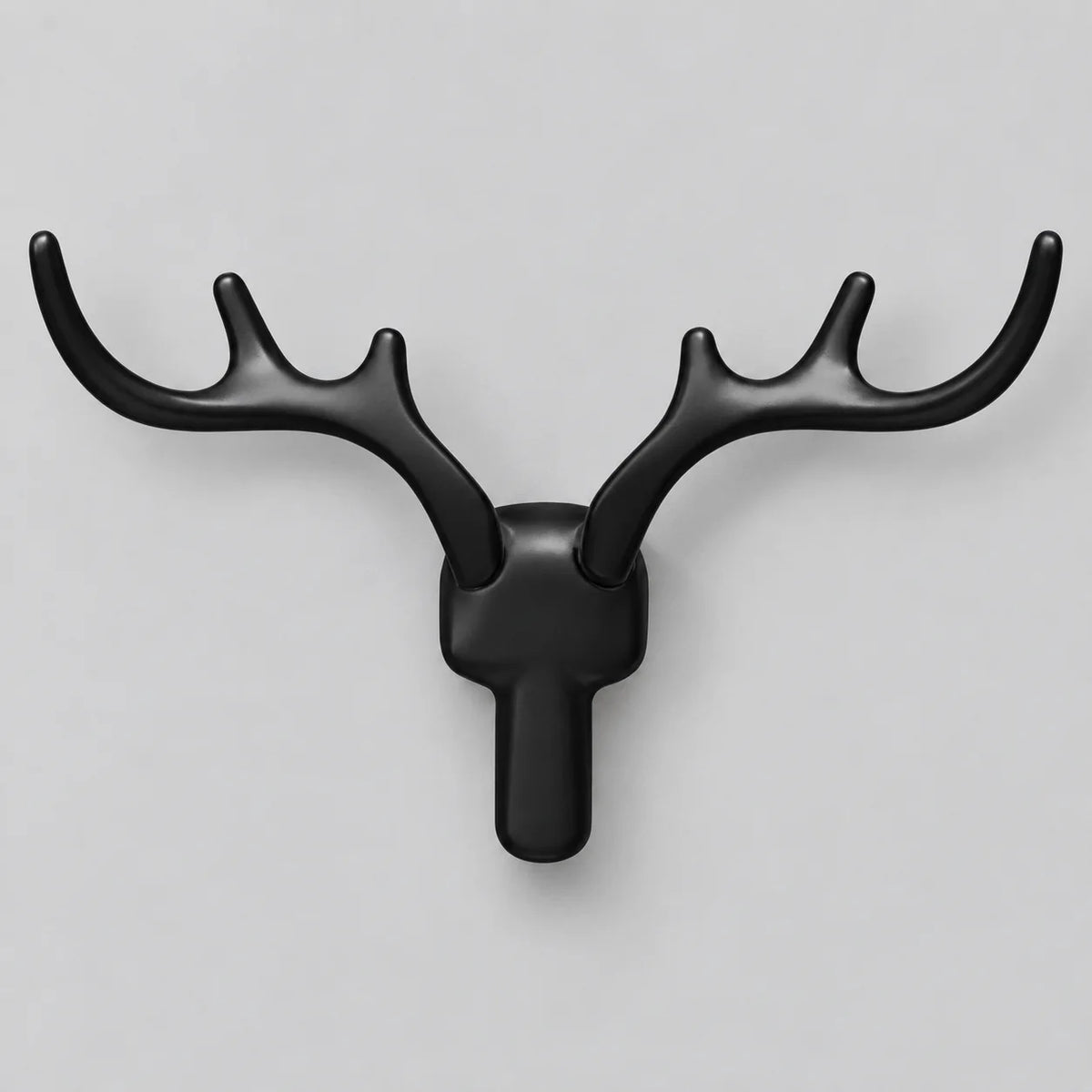 Patère murale cerf noire en alliage de zinc sur fond gris
