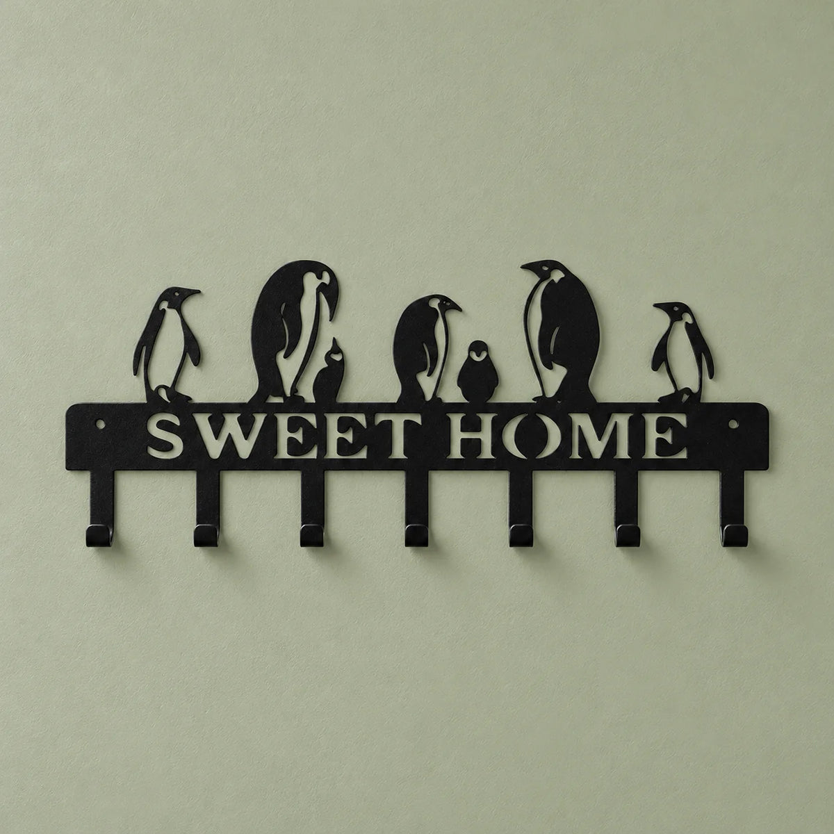 Porte-manteau SWEET HOME noir présenté de face sur fond vert sauge