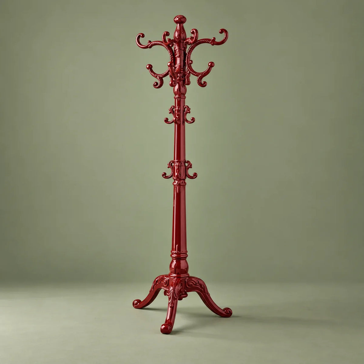 Porte-manteau perroquet rouge sculpté complet sur fond vert sauge