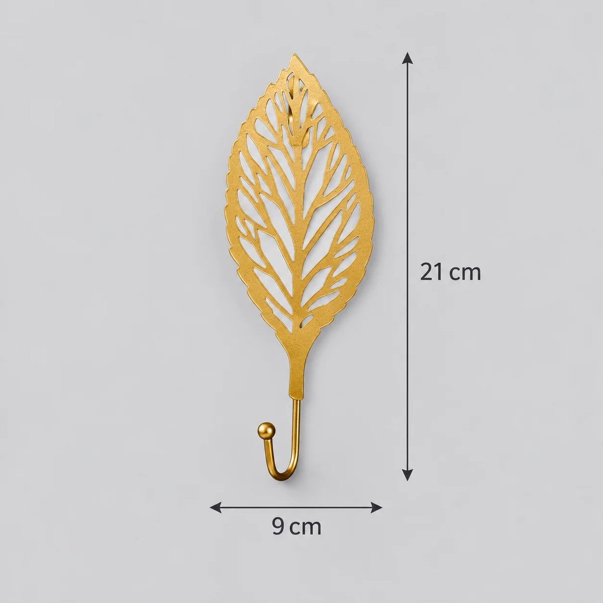 Dimensions vérifiées de la patère Feuille ronde dorée : hauteur 21 cm, largeur 9 cm