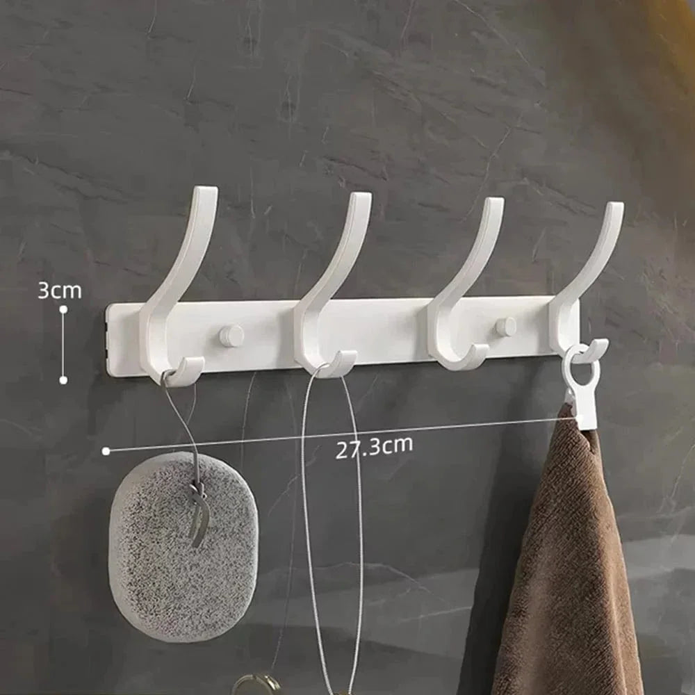 Dimensions vérifiées de la barre du porte-manteau blanc à quatre crochets : largeur 27,3 cm et hauteur de la barre 3 cm ; hauteur totale des crochets non indiquée