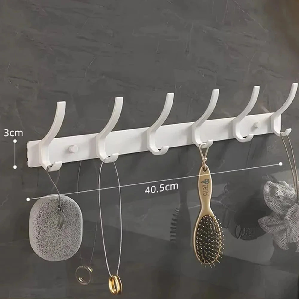 Dimensions vérifiées de la barre du porte-manteau blanc à six crochets : largeur 40,5 cm et hauteur de la barre 3 cm ; hauteur totale des crochets non indiquée