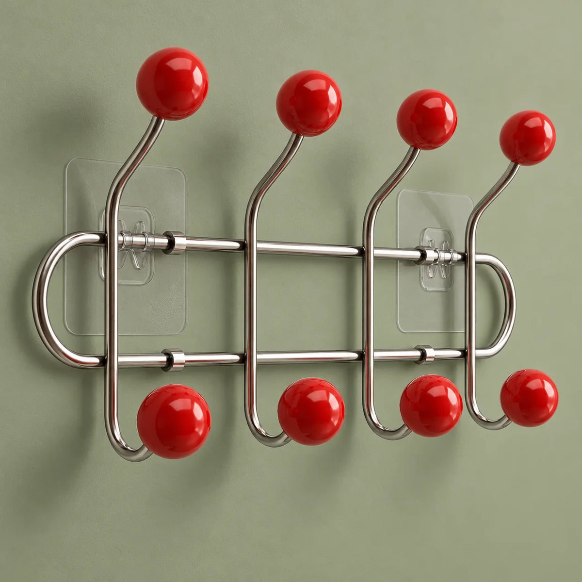 Vue oblique du porte-manteau chromé avec ses huit boules rouges et fixations transparentes
