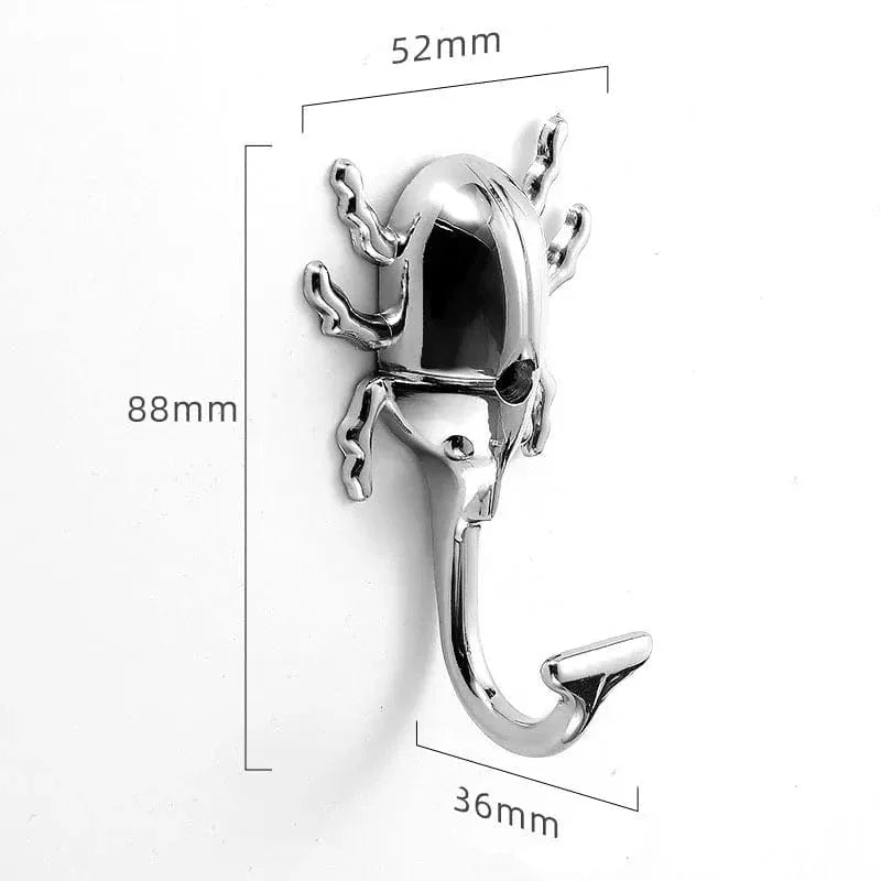 Dimensions de la patère insecte argent selon la photo d'origine : largeur 52 mm, hauteur 88 mm, avancée 36 mm